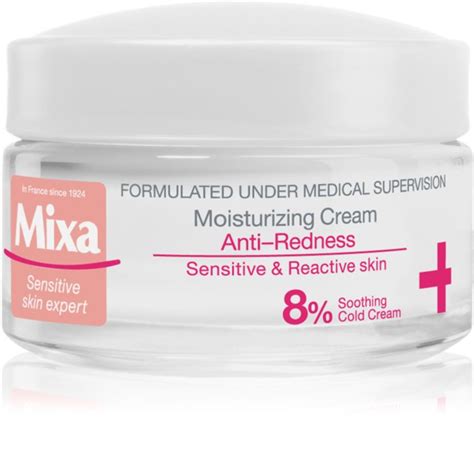 Tematická fotografia: fľaša Mixa Anti-Redness jemného čistiaceho penového gélu pre citlivú pleť na svetlom pozadí s jemnými bublinkami