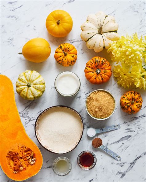Thematic photo of various ingredients for pumpkin masks (honey, yogurt, oil, spices, etc.)